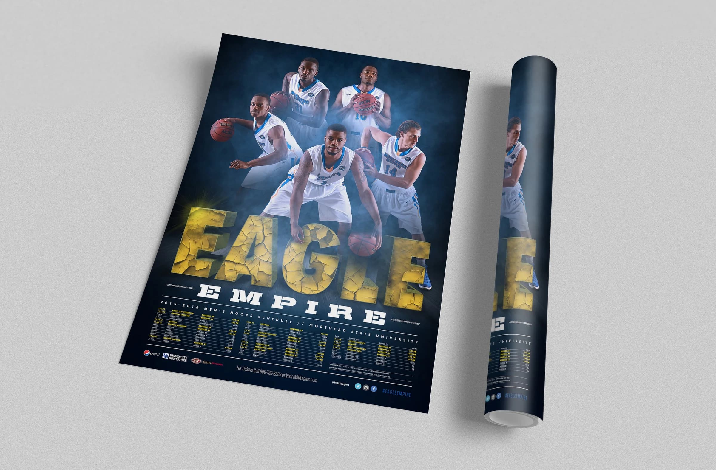 The Eagle Empire men’s basketball poster shown flat and rolled on a gray field