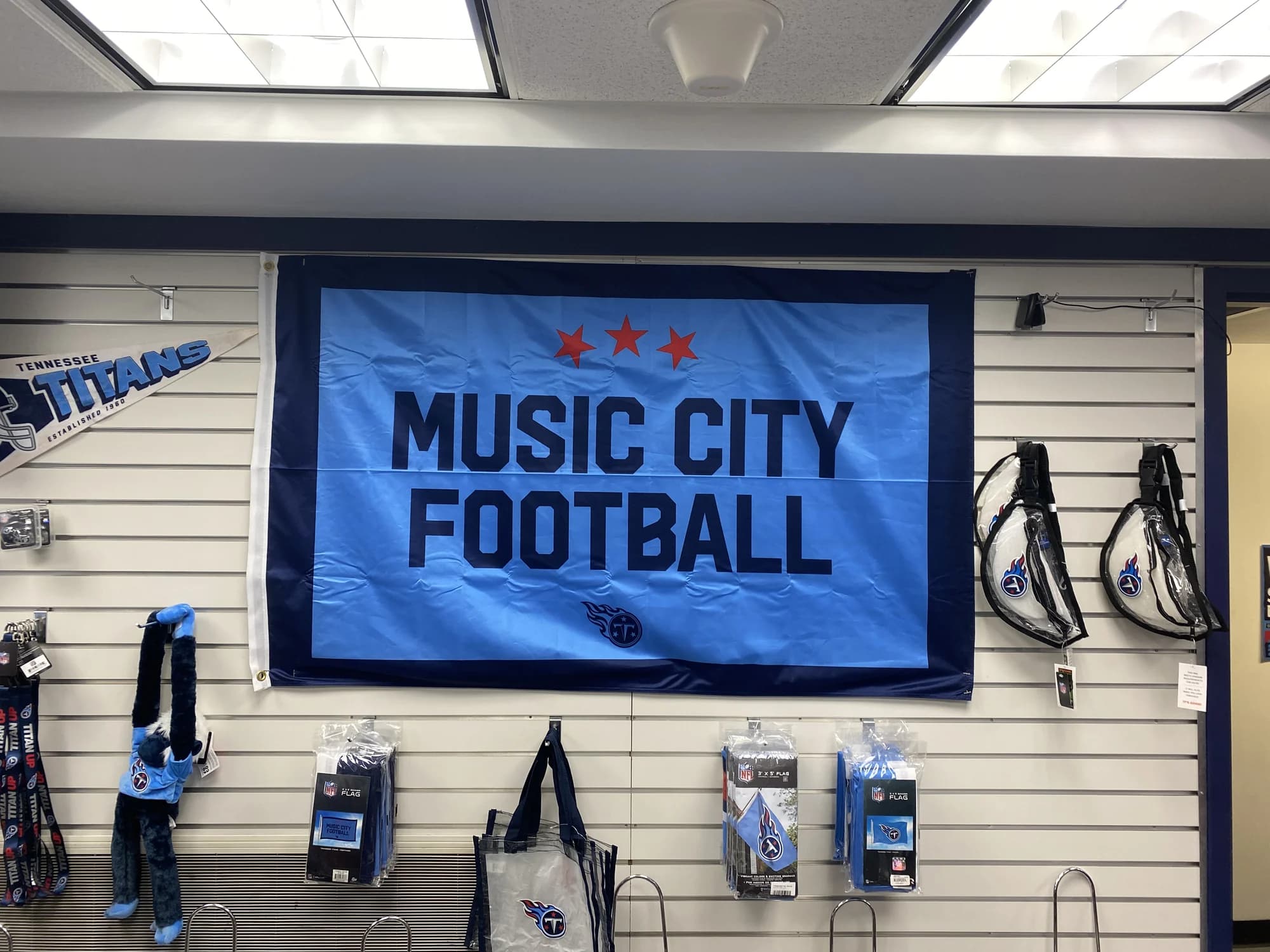 The Music City Football flag hanging on the team store wall